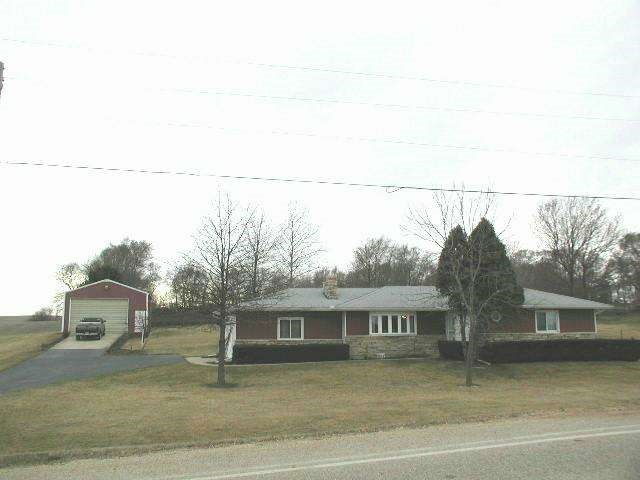 2310 South Rock City Road Ridott, IL 61067 - Photo 9 of 9 a front view of a house with a garden