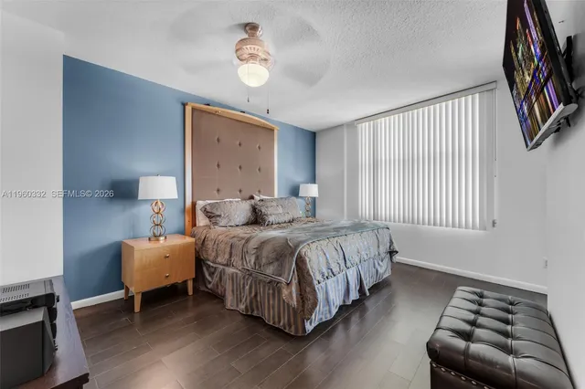 a bedroom with bed and window