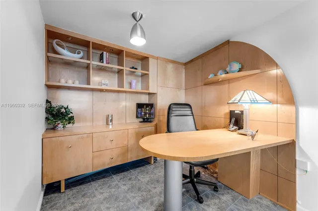 a kitchen with a sink a table and chairs in it