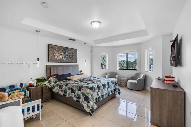 a bedroom with furniture and a window