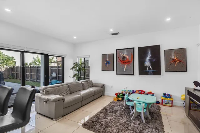 a living room with furniture and window