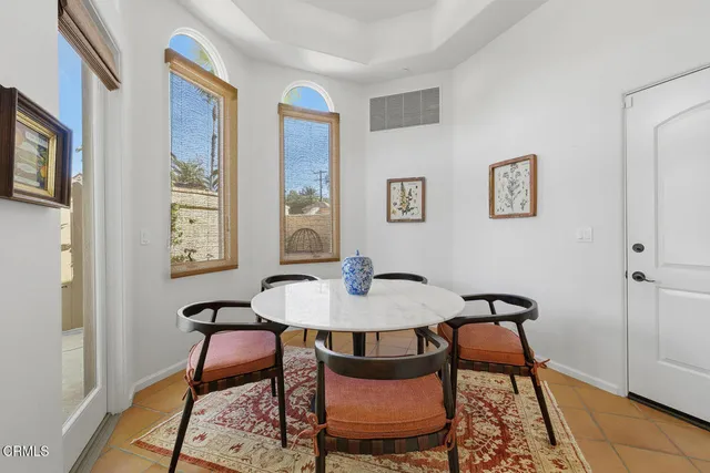a view of a a dining room with furniture and wooden floor