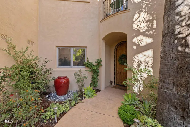 a front view of a house with lots of green space