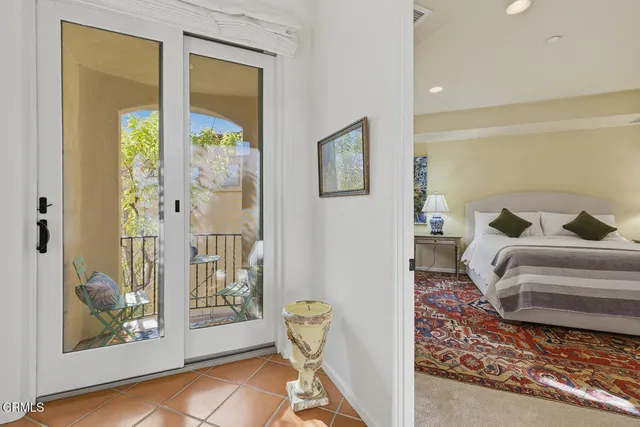 a view of bedroom with furniture and windows