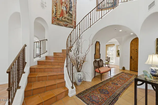 a view of hall way with furniture