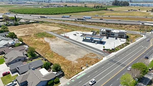 2450 Fulkerth Road Turlock, CA 95380 - Photo 15 of 16 a view of a swimming pool with a lawn chairs and plants