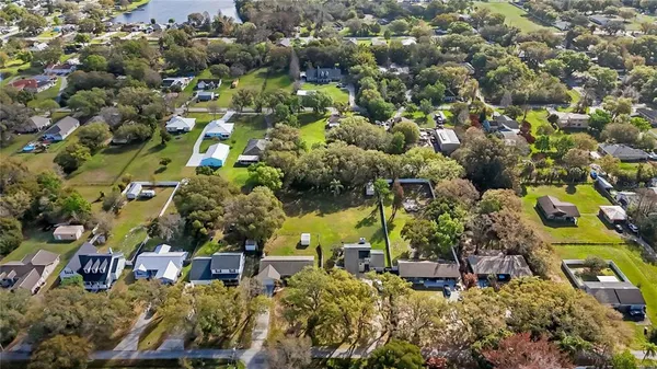 an aerial view of a houses with a yard