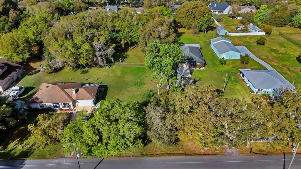 0 Grape Avenue St. Cloud, FL 34769 - Photo 5 of 52 an aerial view of a house with yard swimming pool and outdoor seating