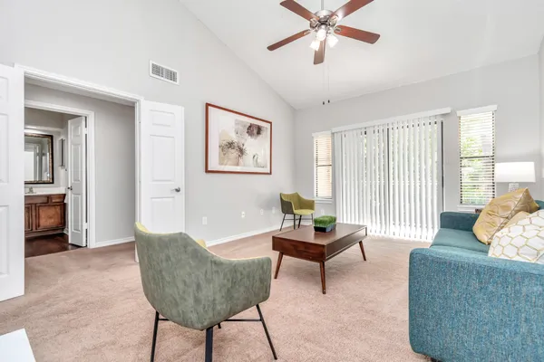 a living room with furniture and a window