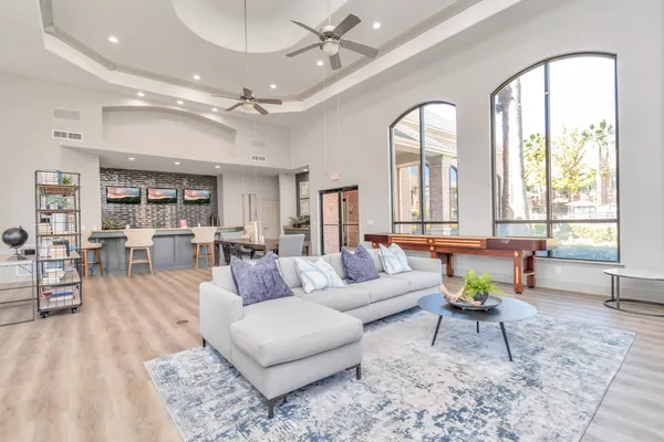 a living room with furniture and a large window