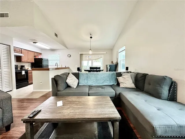 a living room with furniture and a table