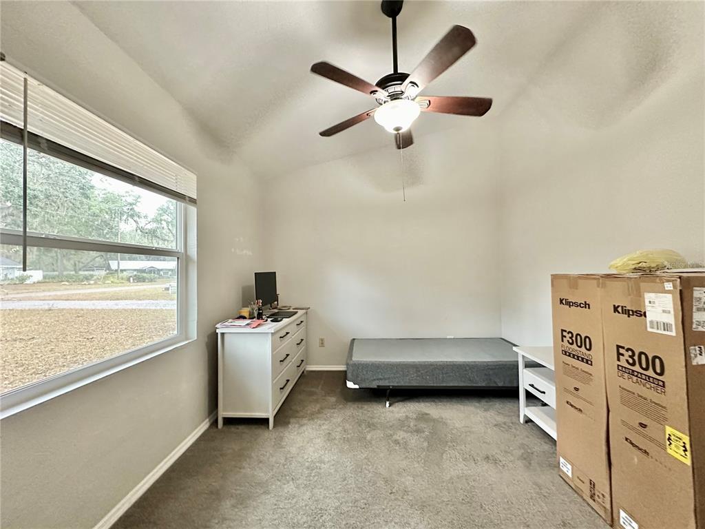 117 Eliam Road Melrose, FL 32666 - Photo 9 of 12 a bedroom with a bed and a window