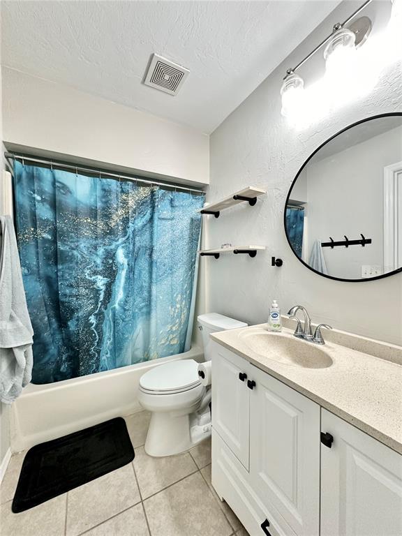 117 Eliam Road Melrose, FL 32666 - Photo 10 of 12 a bathroom with a sink a toilet a mirror and shower