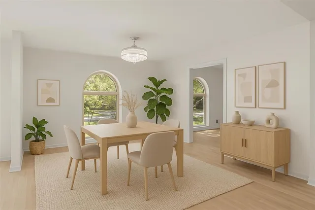 a view of a dining room with furniture and a window