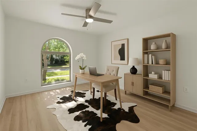 a workspace with furniture and a window