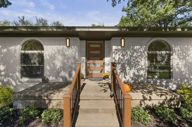 a front view of a house with parking