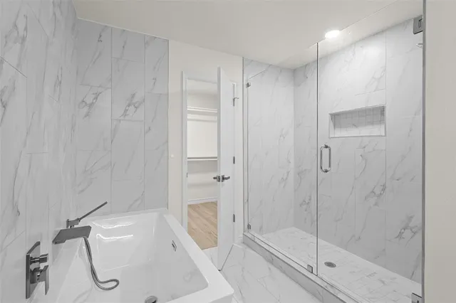 a bathroom with a toilet and shower