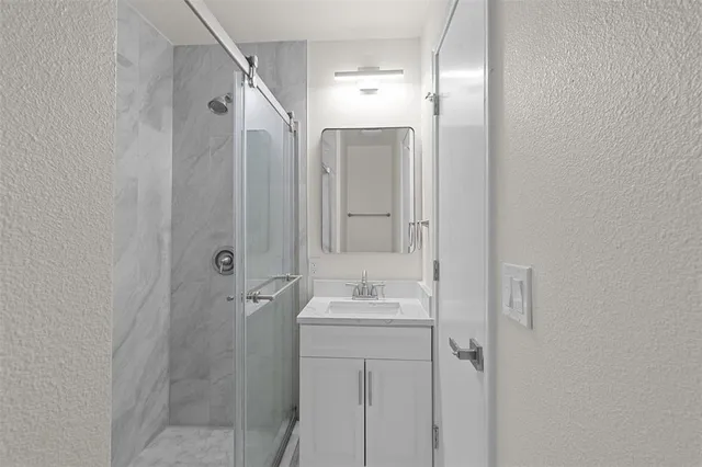 a bathroom with a sink and mirror