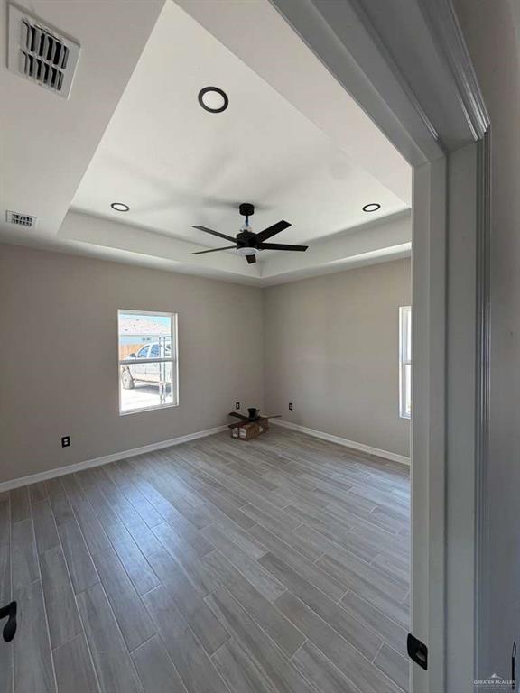 Lot 23 Farrell Road, Unit 1 Weslaco, TX 78596 - Photo 5 of 9 wooden floor in an empty room