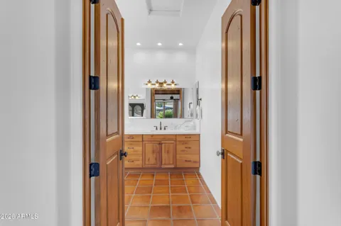 a bathroom with a mirror and a sink