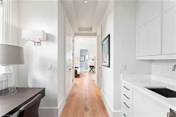 a view of a kitchen from the hallway