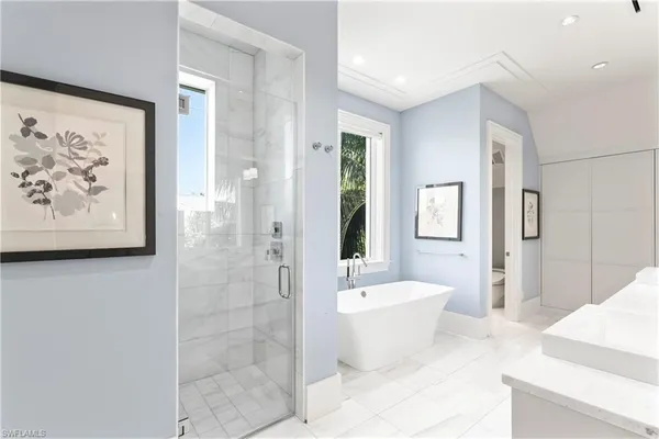 a bathroom with a bathtub and shower