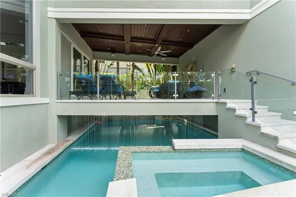 a view of a swimming pool with a patio