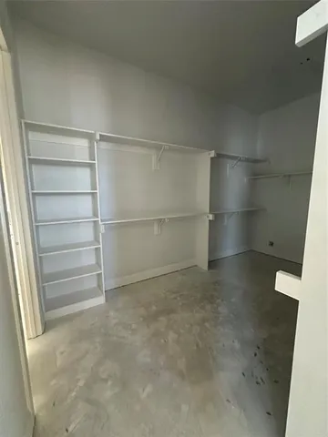 a view of an empty walk in closet