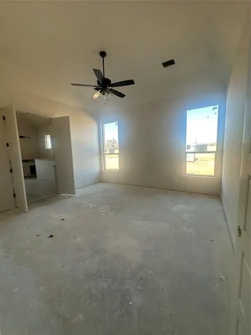 an empty room with a empty space and windows