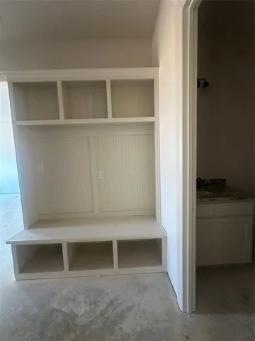 a utility room with sink dryer and washer