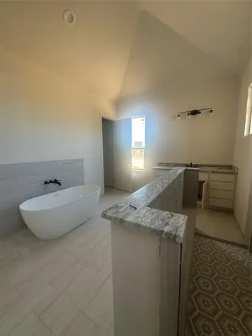 a large room with a table and chairs