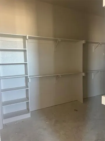 a view of empty room with a fireplace