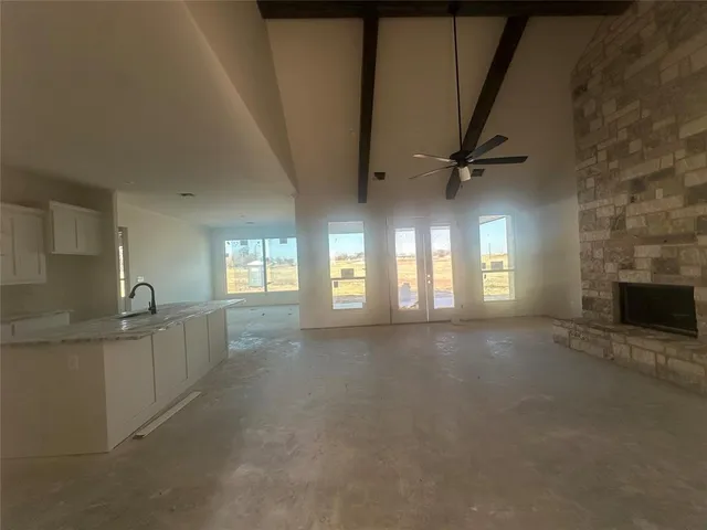 wooden floor in an empty room with a fireplace