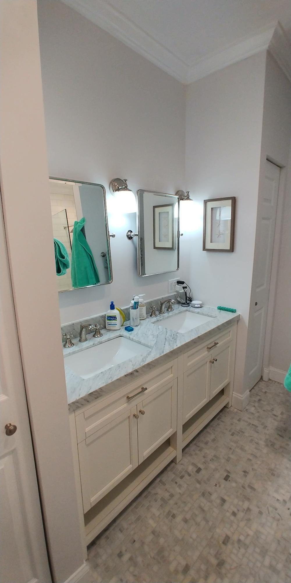 17042 Traverse Circle Jupiter, FL 33477 - Photo 18 of 30 a spacious bathroom with a granite countertop sink and a mirror