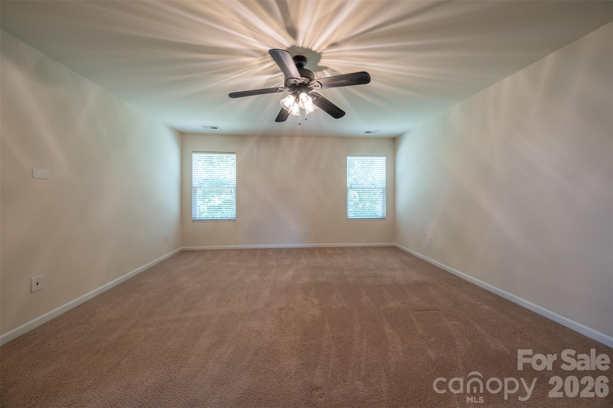 3006 Houndscroft Road Indian Trail, NC 28079 - Photo 39 of 39 an empty room with windows and fan