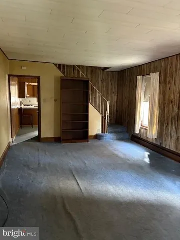 a view of an empty room with a fireplace