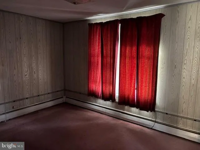 a view of a room with wooden walls