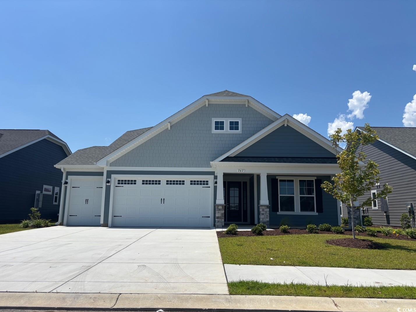767 St Vincent Loop Little River, SC 29566 - Photo 1 of 1 Craftsman inspired home featuring a garage, a fron