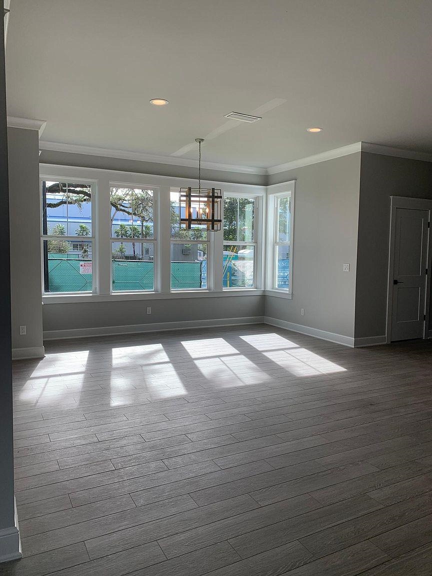 121 Cherokee Street St. Augustine, FL 32084 - Photo 11 of 33 a view of empty room with wooden floor and fan