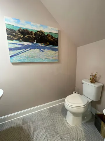 a bathroom with a toilet and a sink