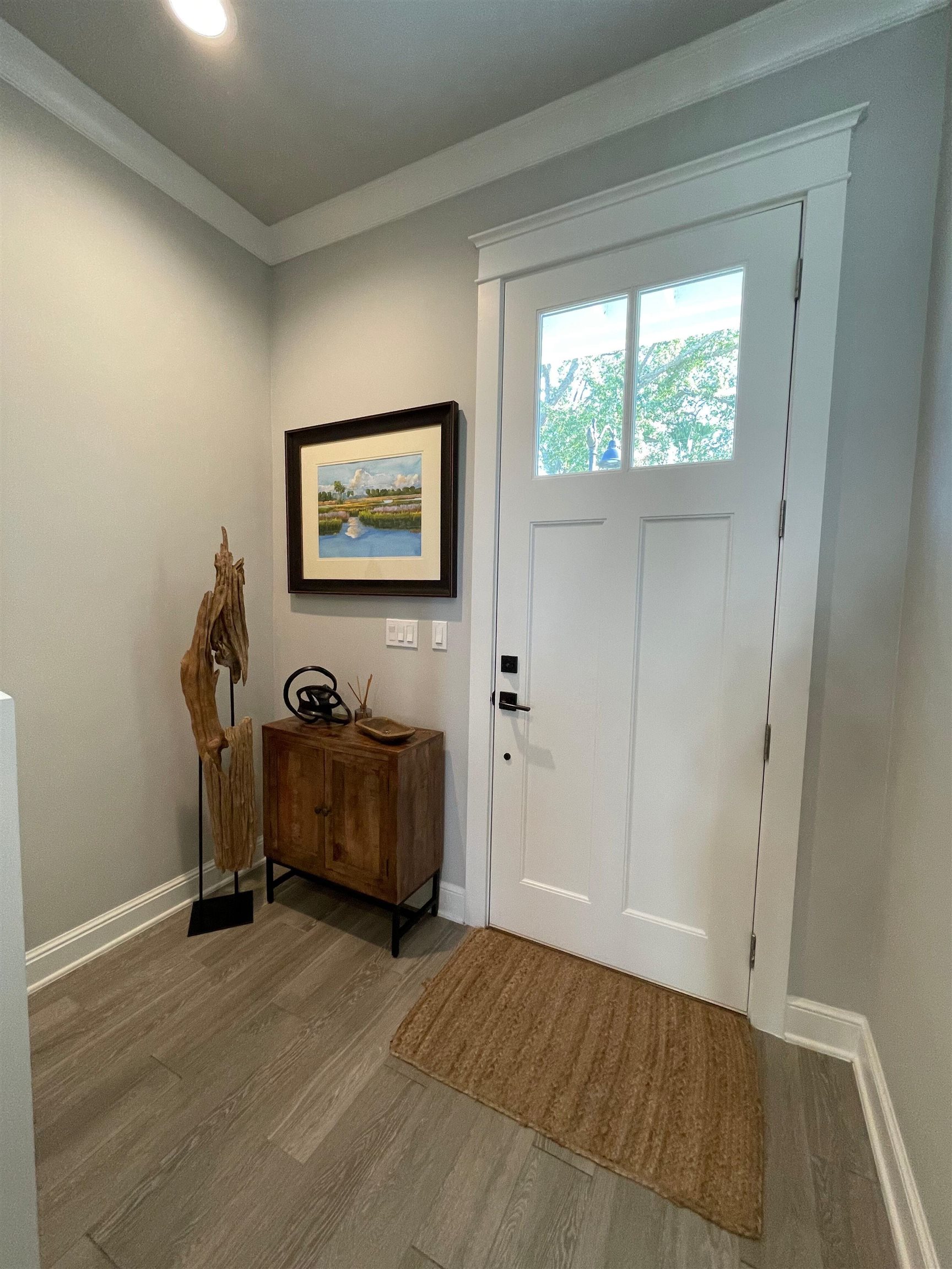 121 Cherokee Street St. Augustine, FL 32084 - Photo 14 of 33 a view of an empty room with wooden floor and a window