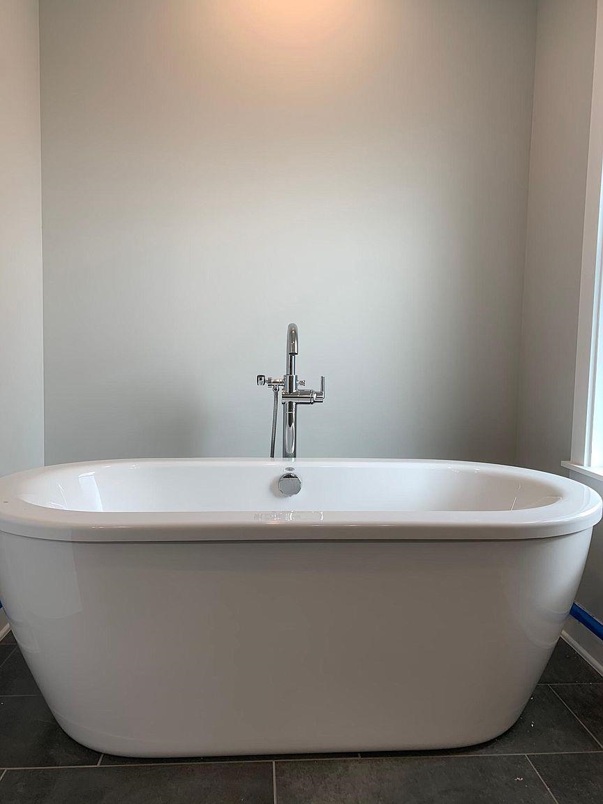 121 Cherokee Street St. Augustine, FL 32084 - Photo 21 of 33 a white bath tub sitting in a bathroom