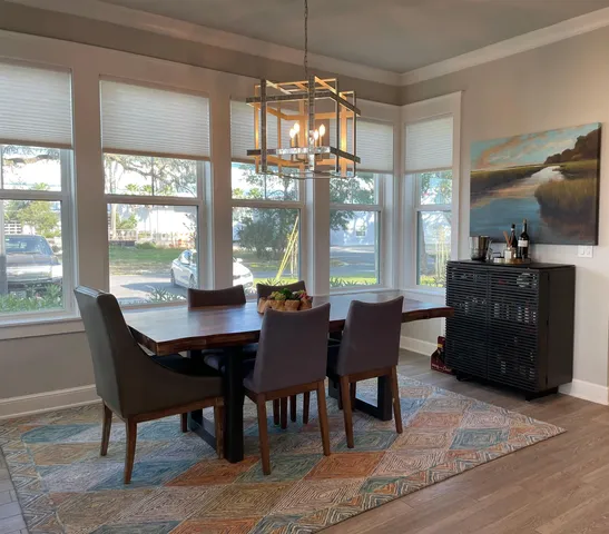 a view of a dining room with furniture window and outside view