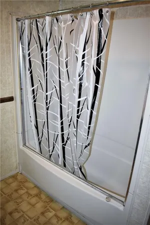 a view of a closet with white walls