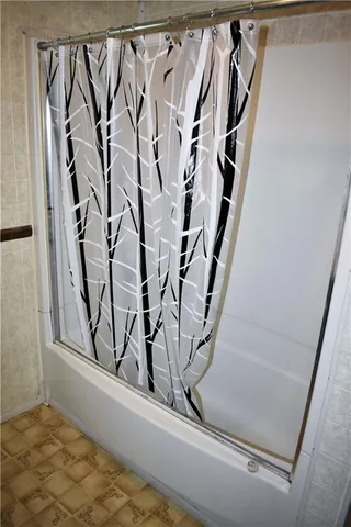 a view of a closet with white walls