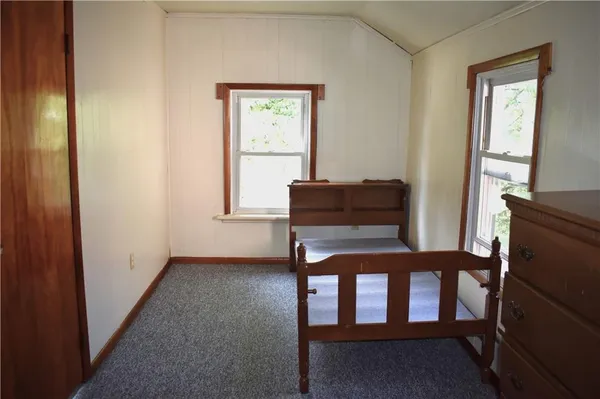 a view of an empty room and a window