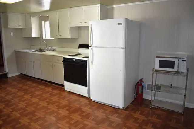 a dining room with a table and chairs