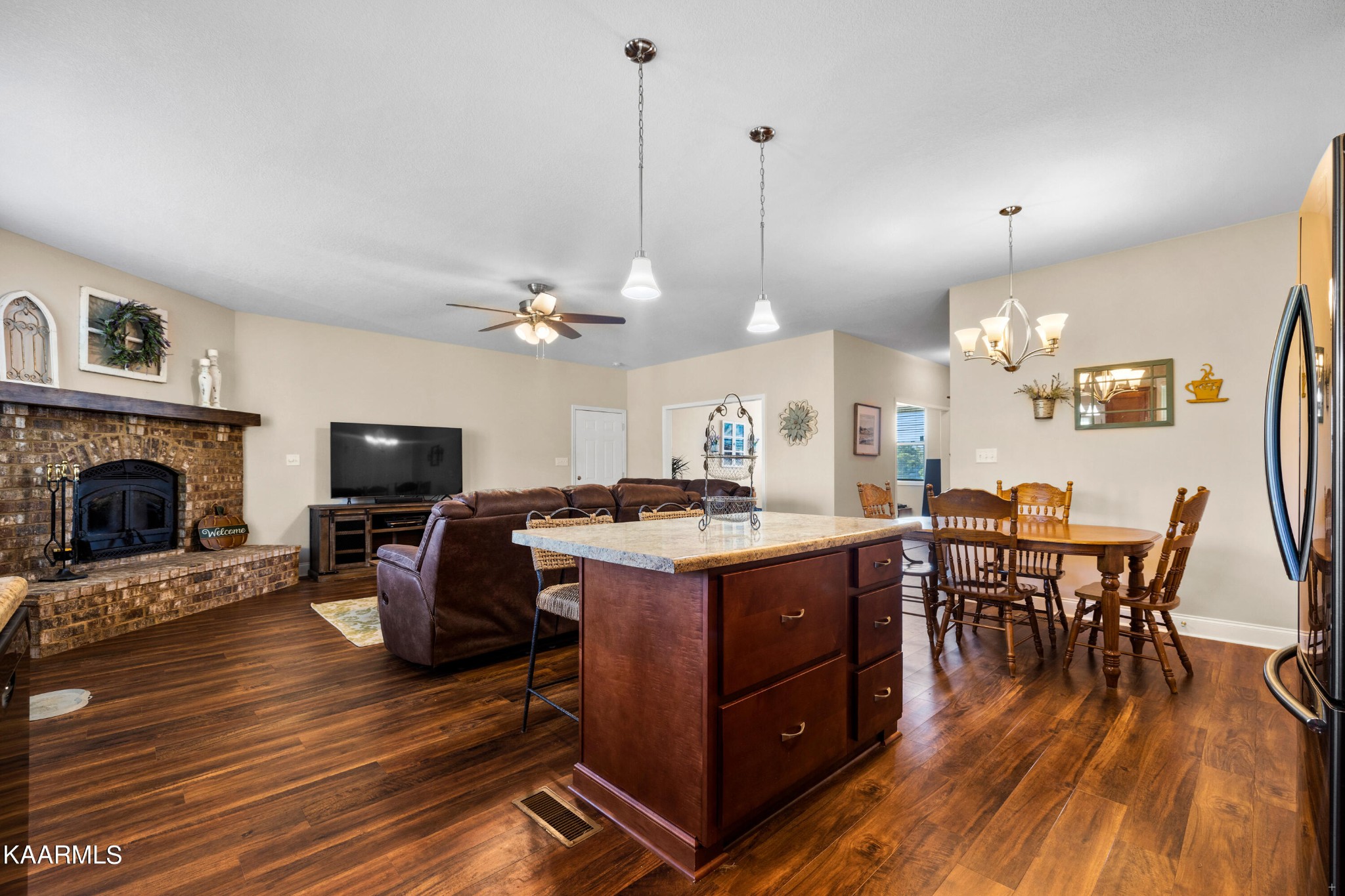 820 Kodak Road Kodak, TN 37764 - Photo 11 of 45 a view of a dining room with furniture a chandelier and wooden floor