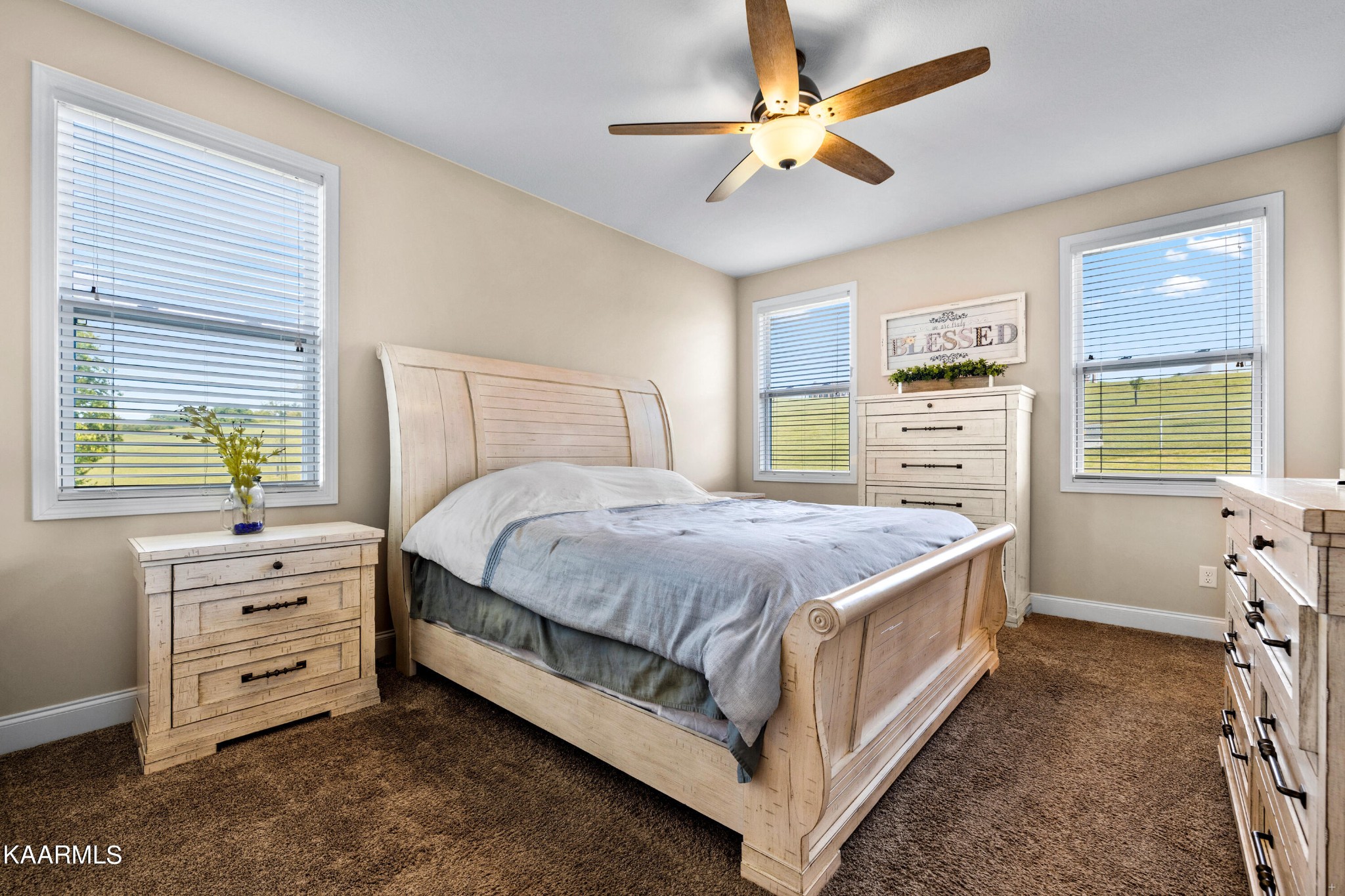820 Kodak Road Kodak, TN 37764 - Photo 16 of 45 a spacious bedroom with a bed and a dresser