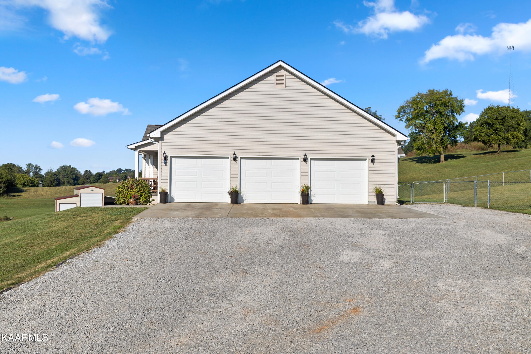 820 Kodak Road Kodak, TN 37764 - Photo 30 of 45 a view of a house with a yard and a garage